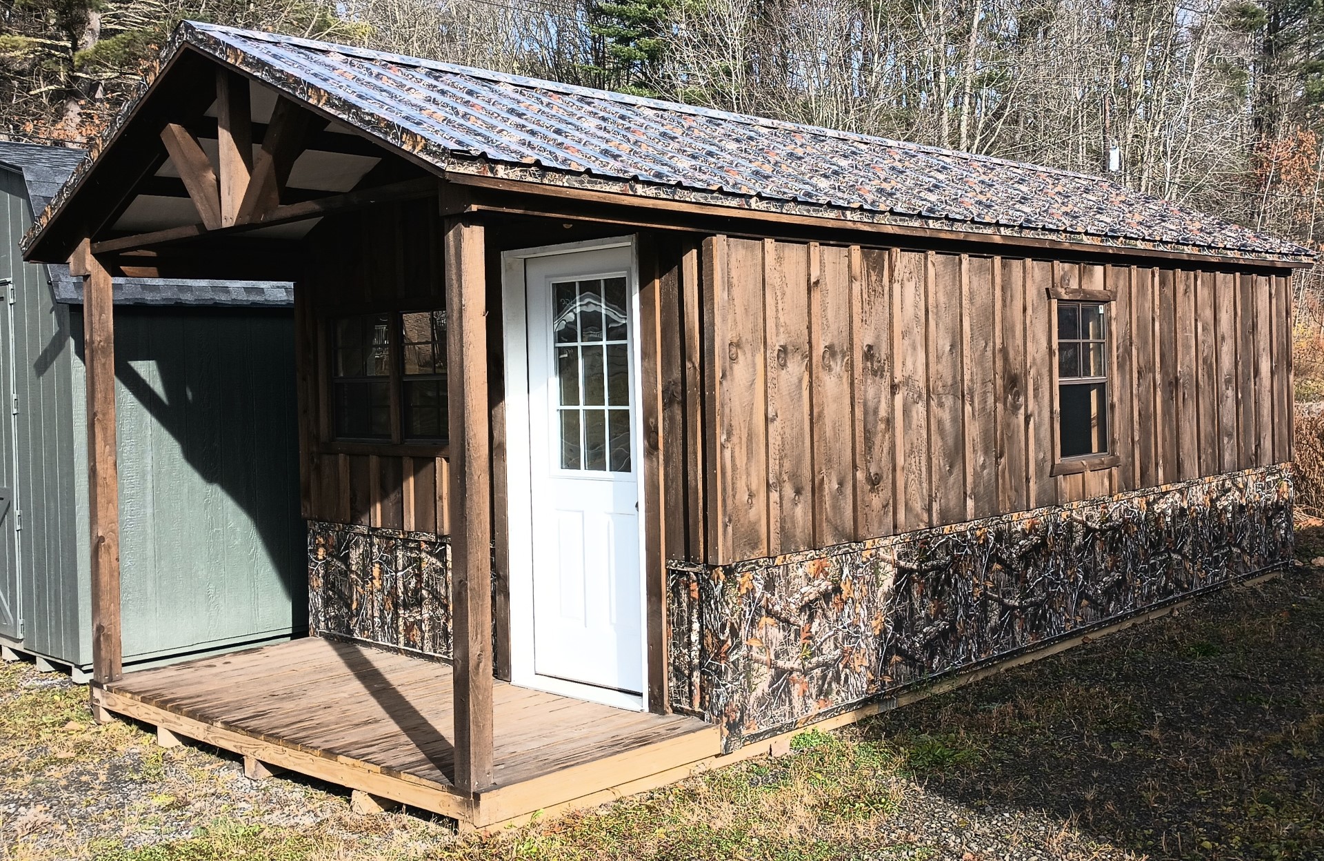 Rustic Cabin with Camo Metal Bottom and Porch