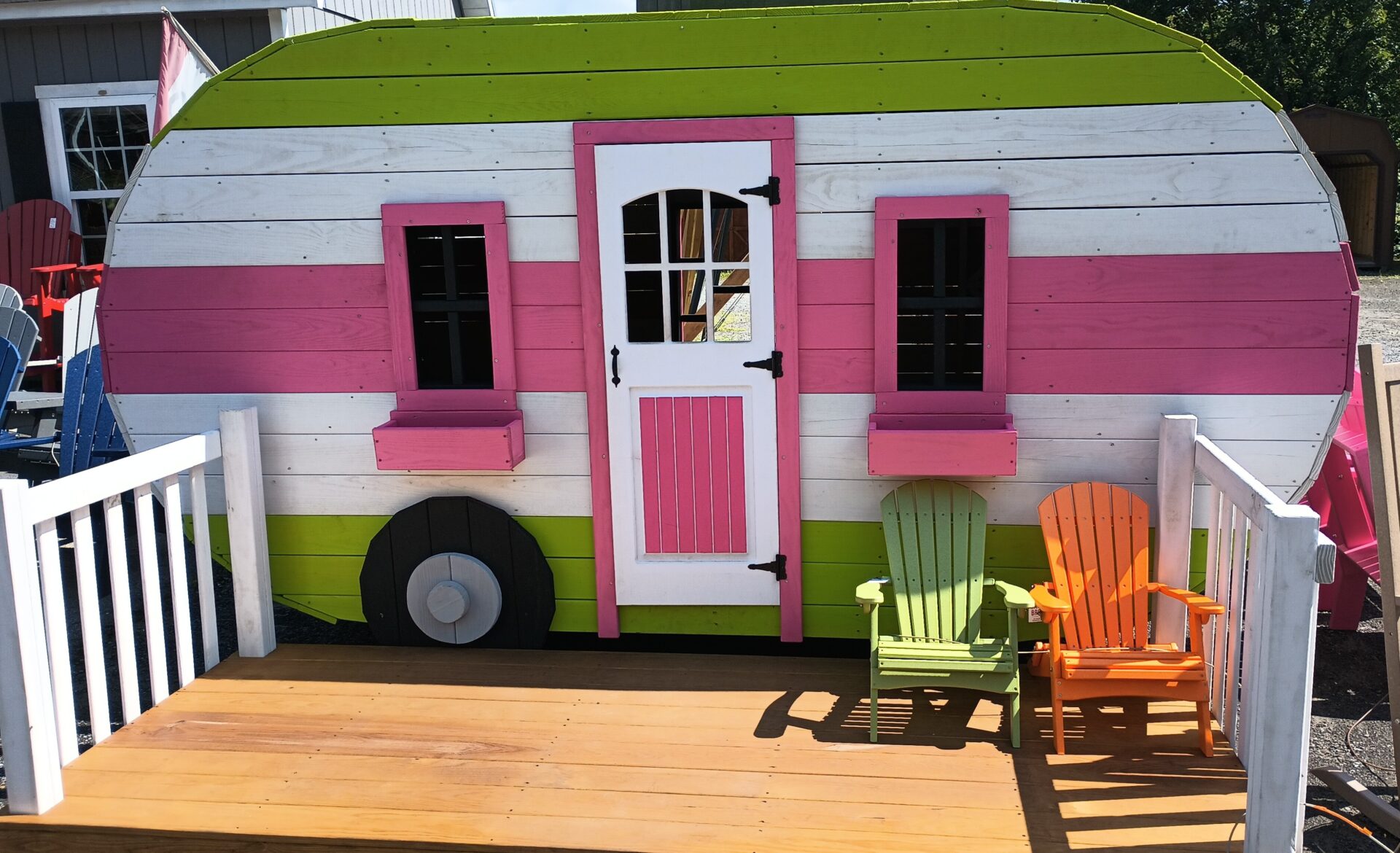 Green, white and pink camper playset with front porch