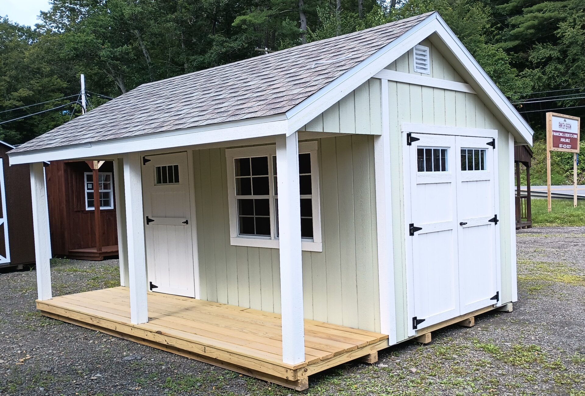 Light green shed with 4' porch on front