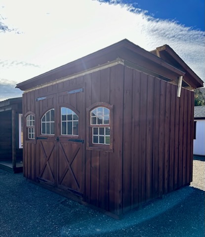Hinged roof shed with double doors and arched windows