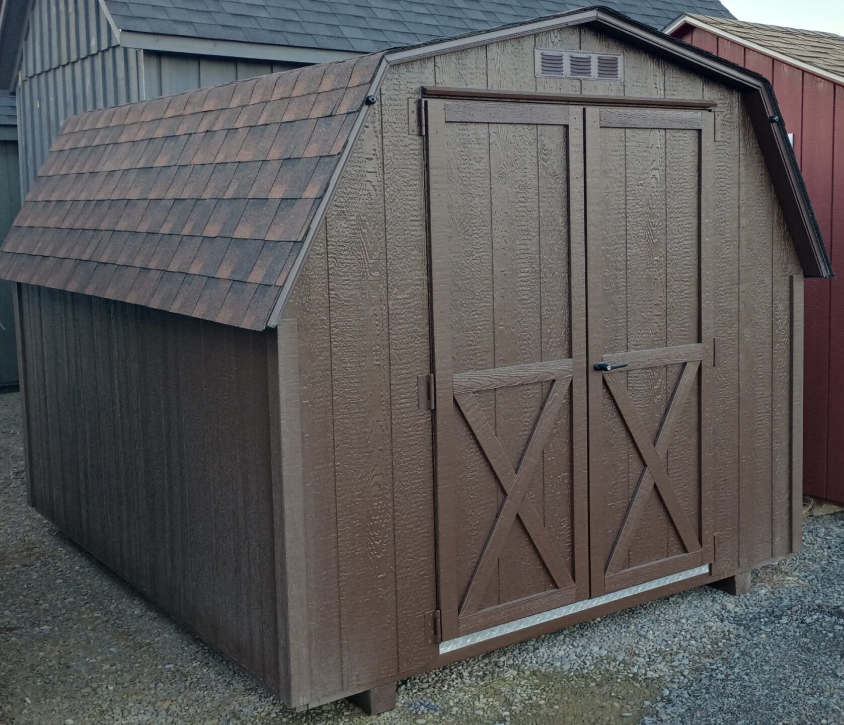 Brown wall barn with hickory shingles and double doors