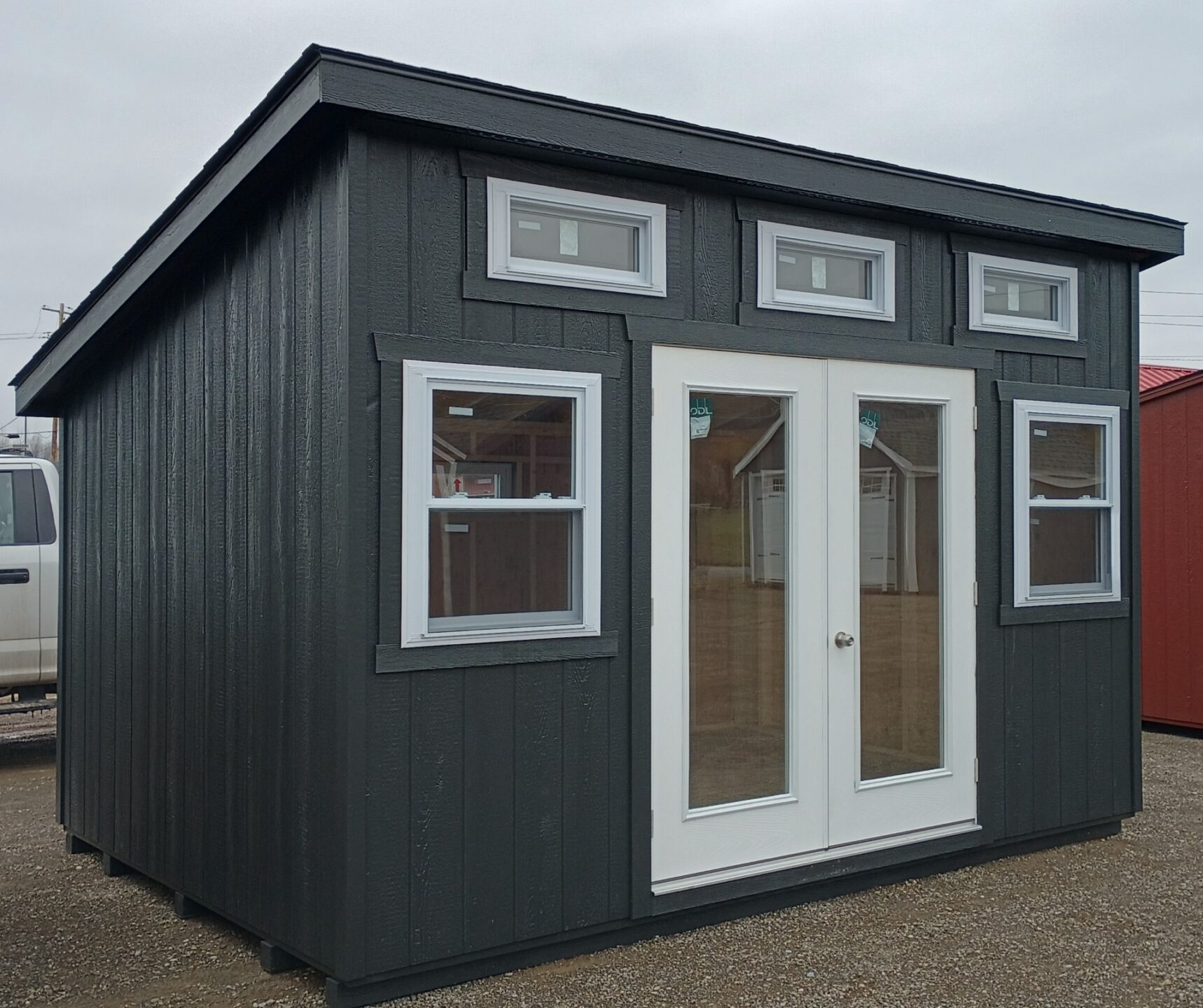 One slant style shed with french doors and transom windows