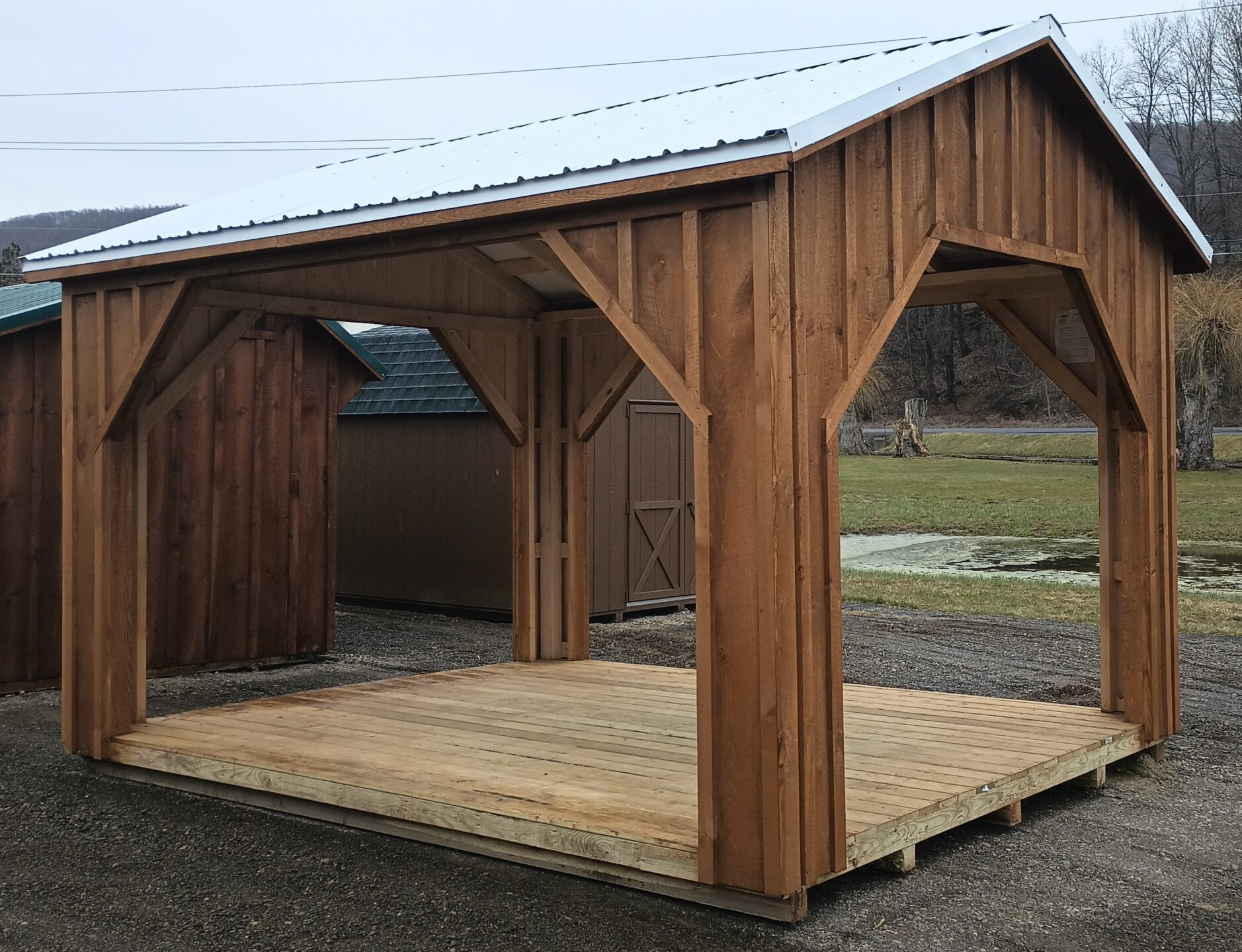 Open sided pavilion with floor and metal roof