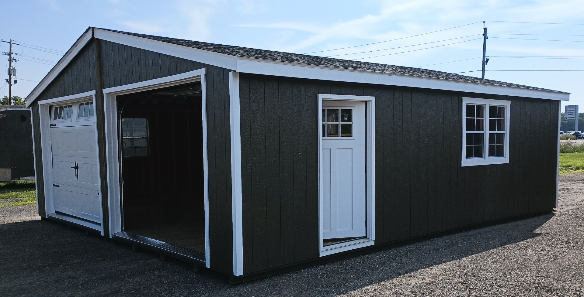 Double garage with two garage doors, side door and 4 windows