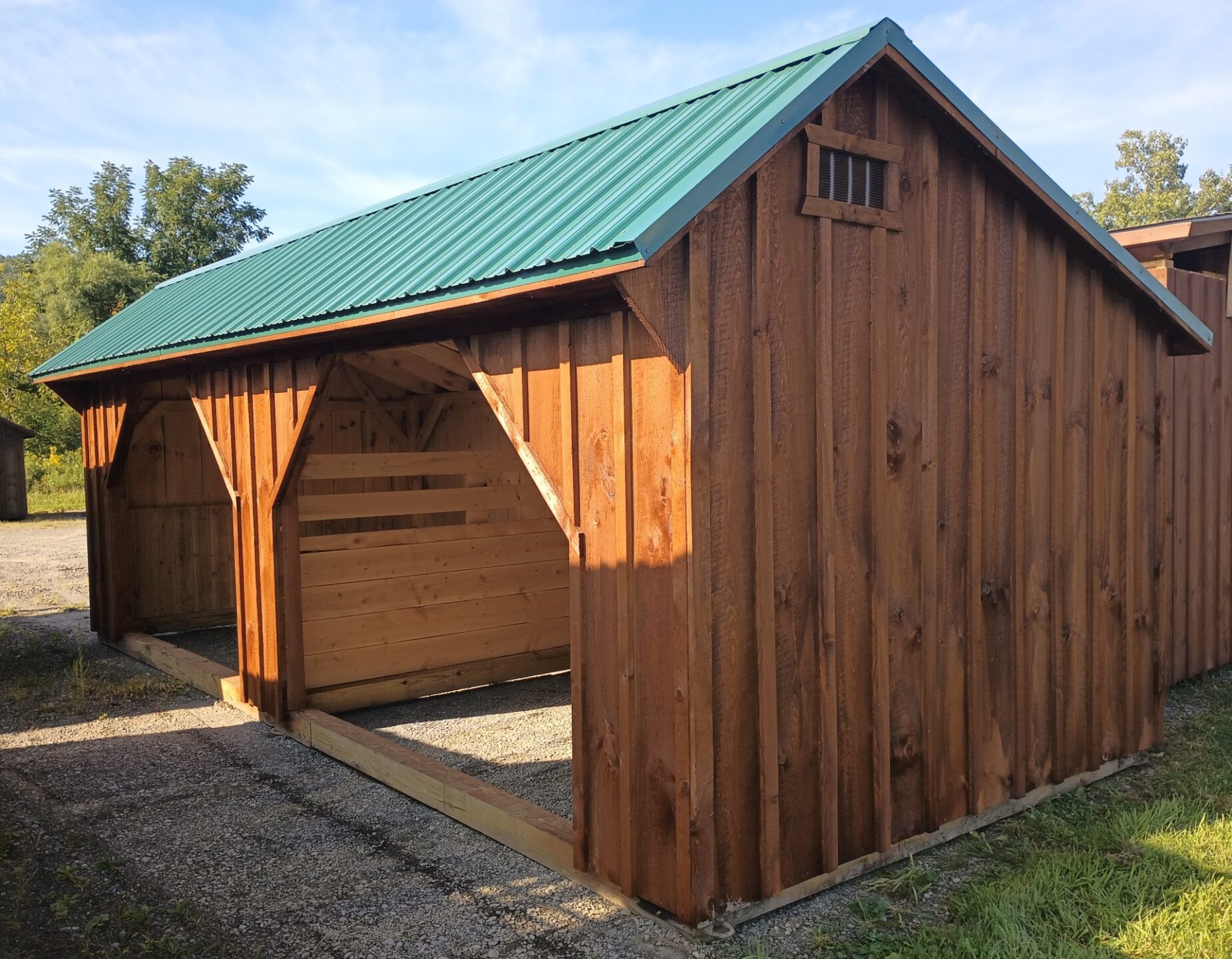 Double Run In with board and batten siding and metal roof