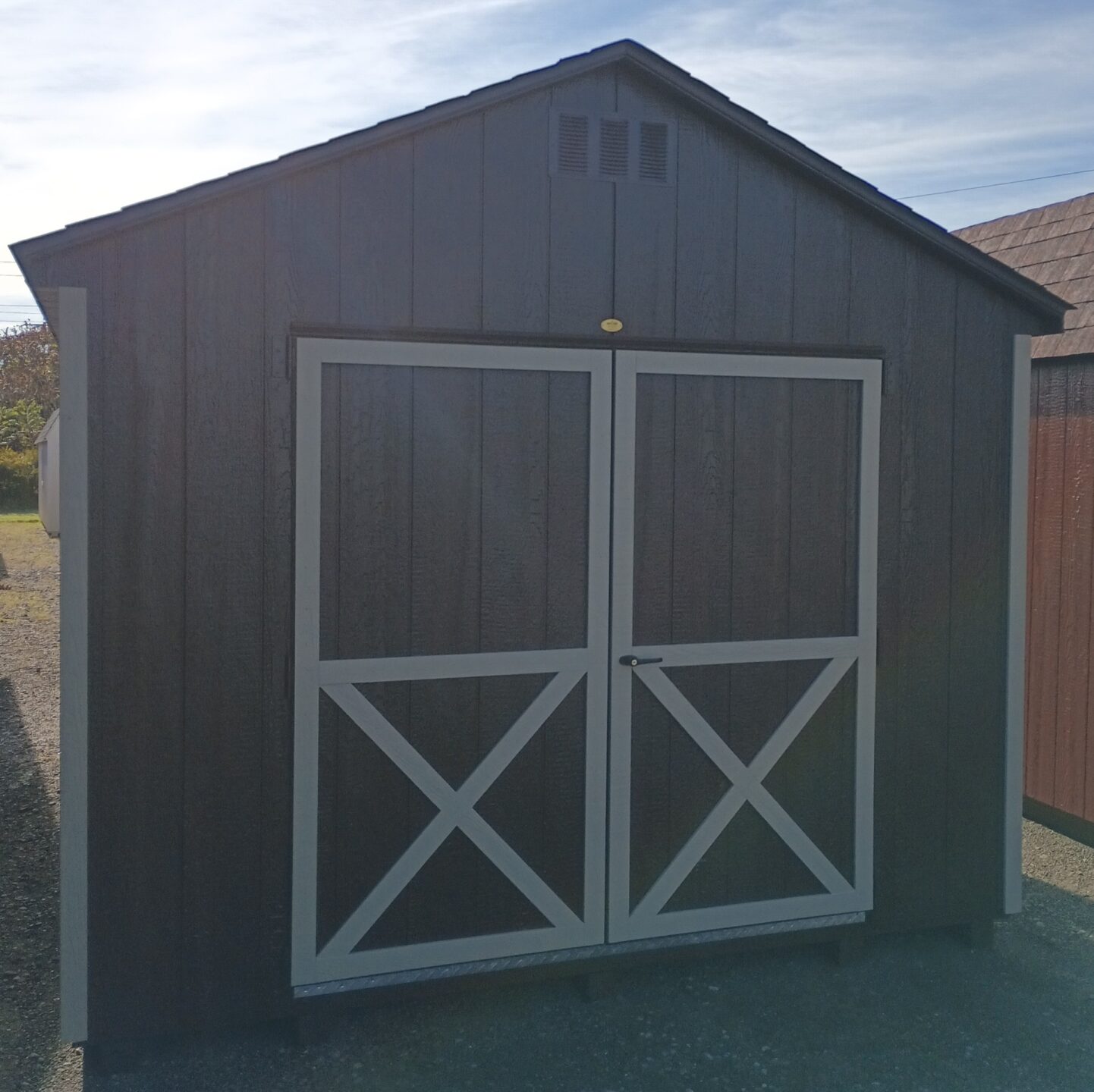 Shed with double doors and shingled roof