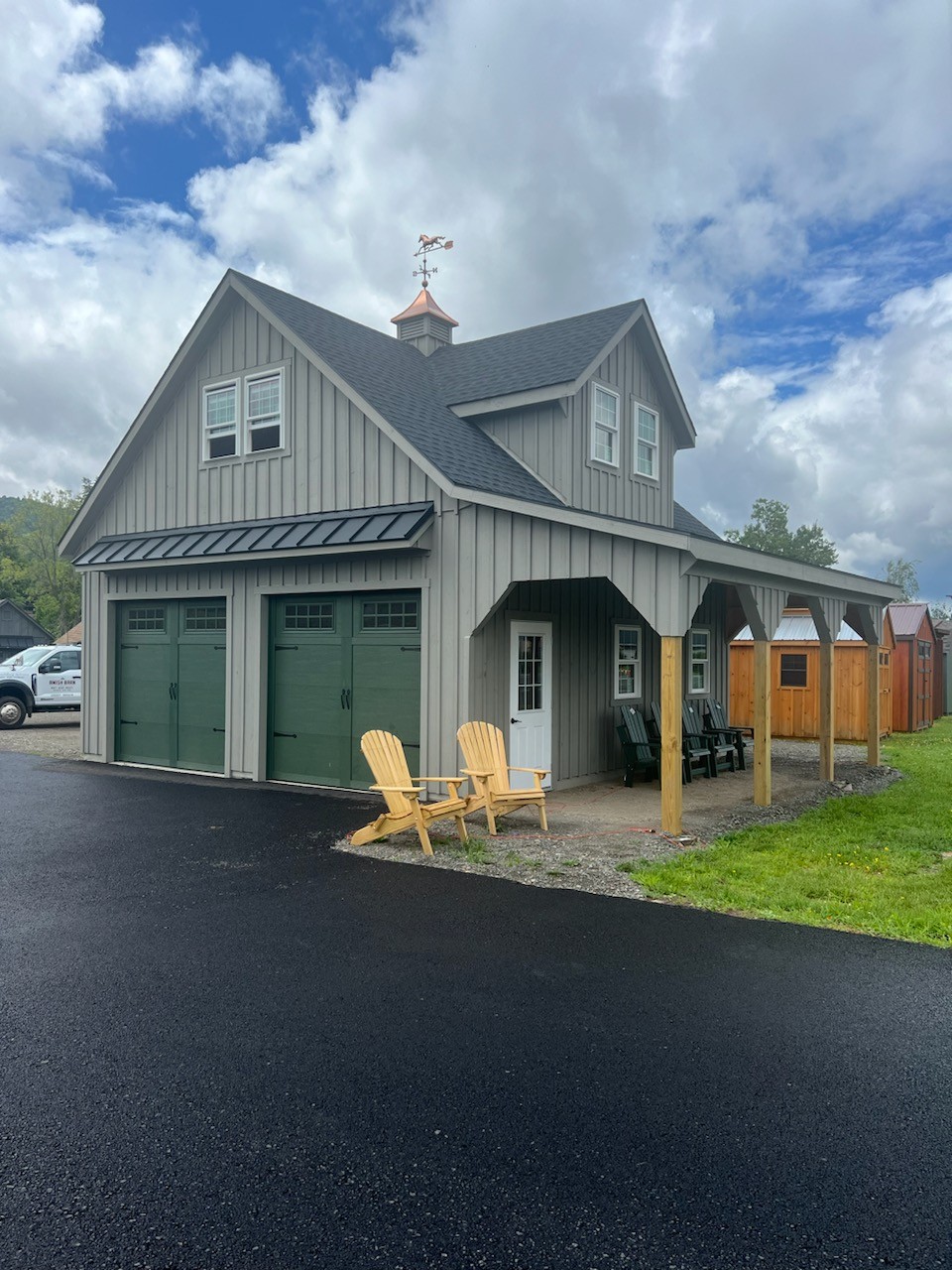 Large garage with dormer, 2 overhead doors and 8' overhang on the front