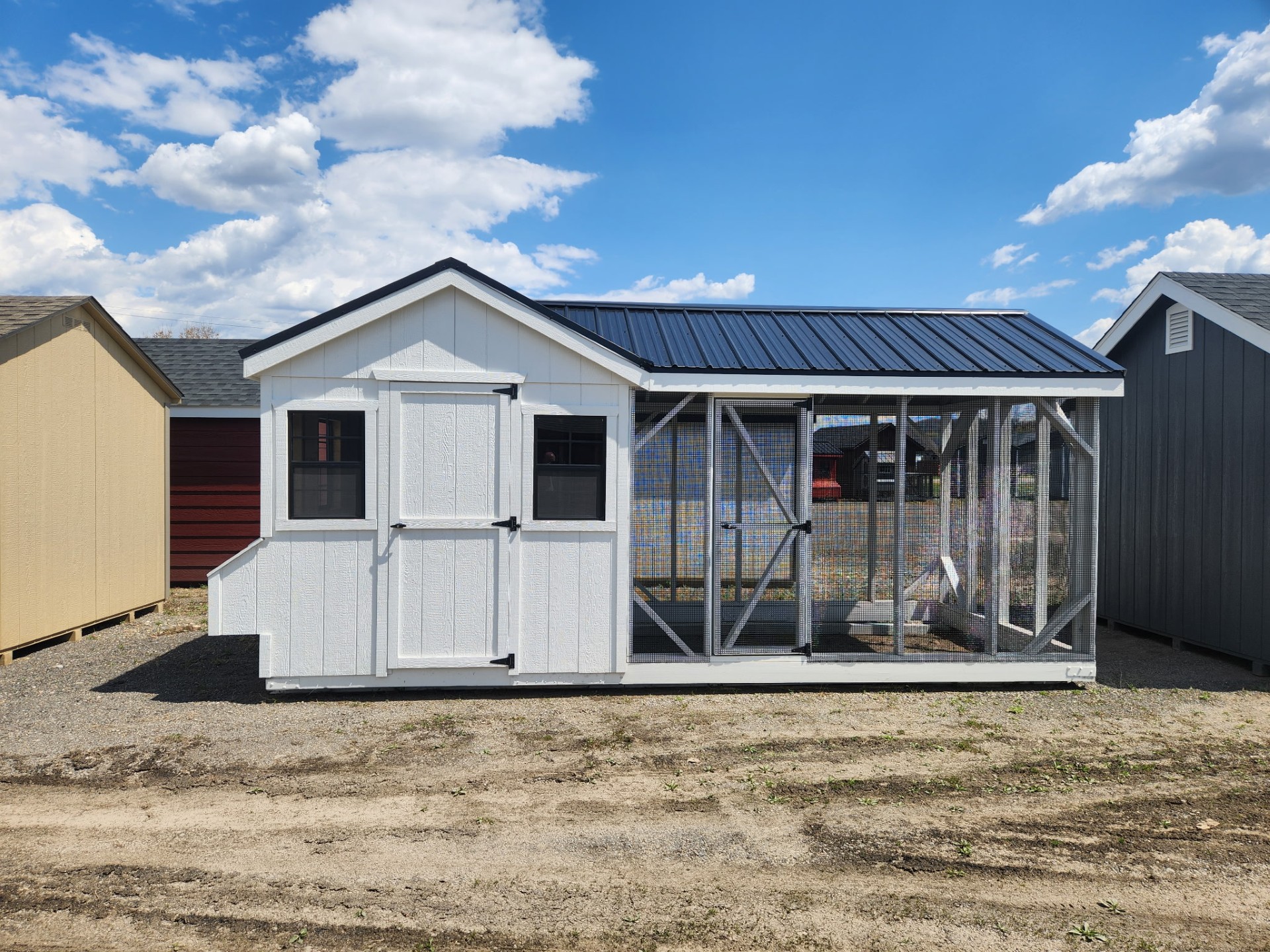 White aframe coop with run area, 3 windows, entry door and nesting boxes