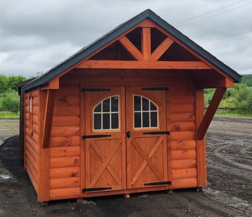 Small shed with overhang, log siding, double doors and shingles