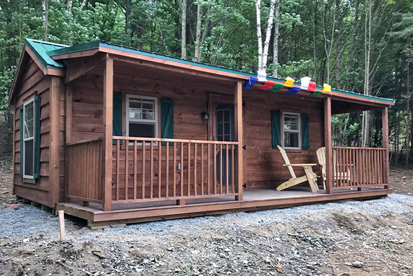 Amish-built frontier cabin with spacious front porch