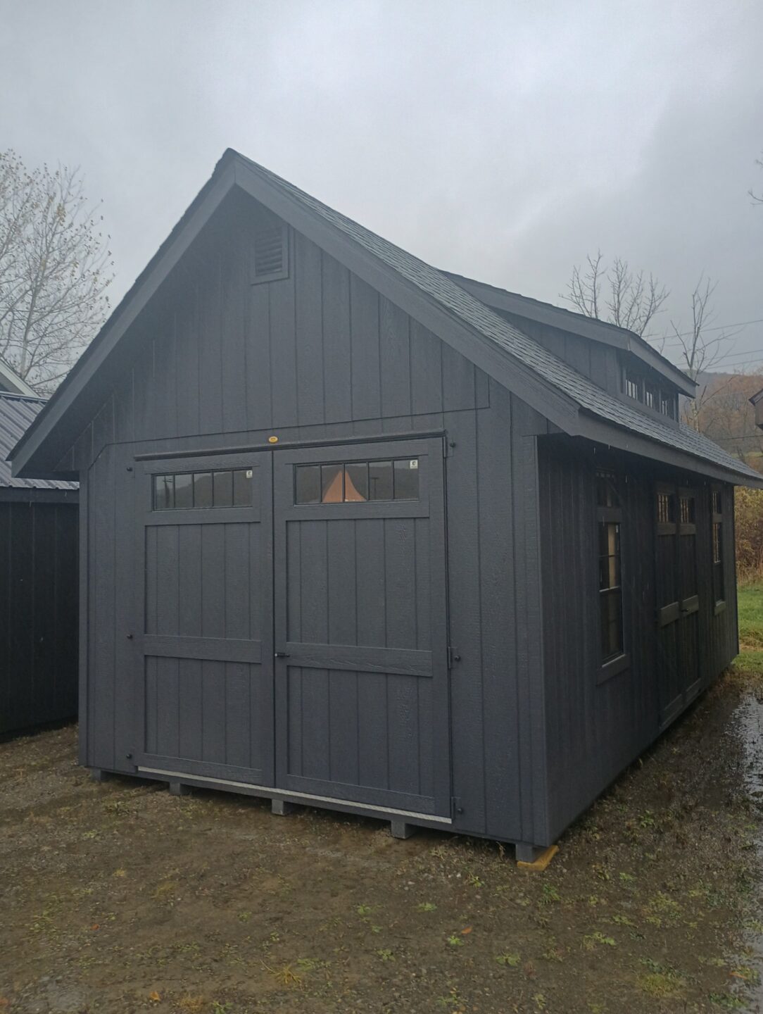 Hinged roof shed with transom dormer, double doors and two windows