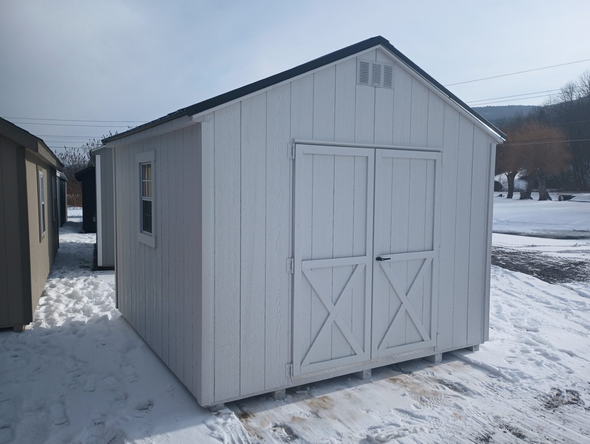 10x10 A Frame LP Smart Panel Siding painted white with white trim and black metal roof (1) double door and (2) 18