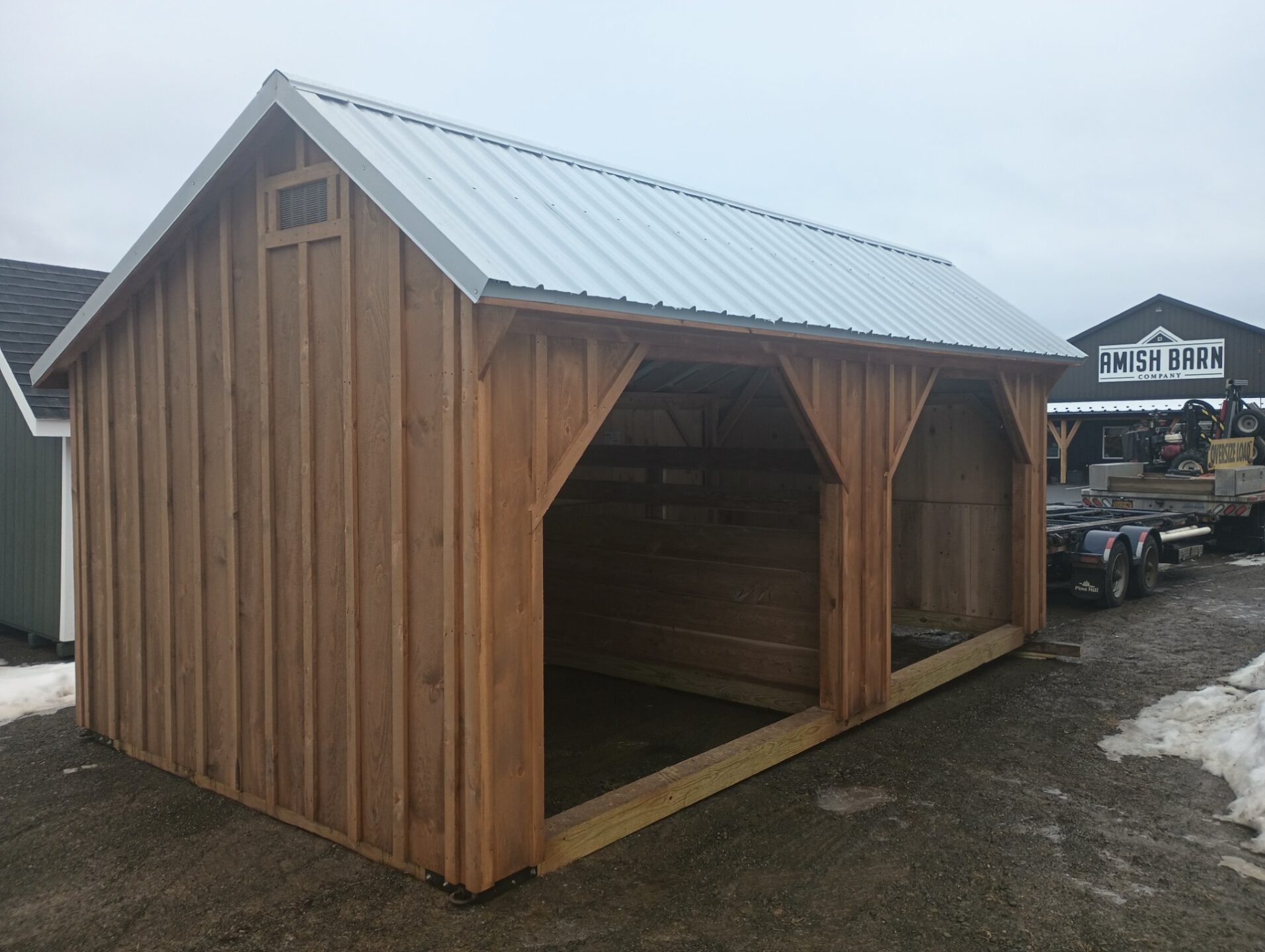Board and Batten sided double run in with metal roof and no floor